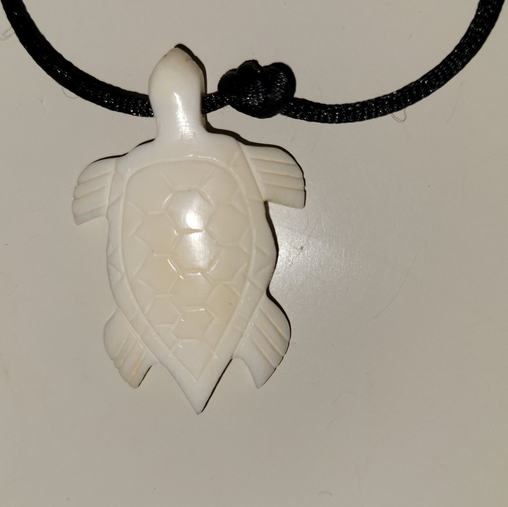 Prosperity sea turtle carved from natural bone.